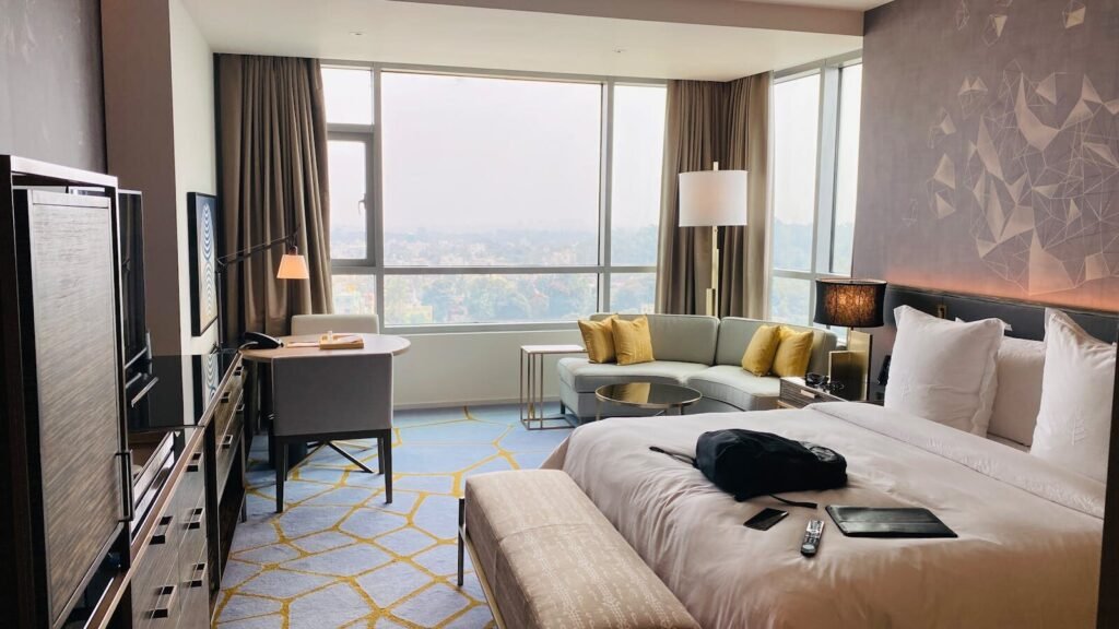 Elegant hotel suite with modern design and city view in Bengaluru.
