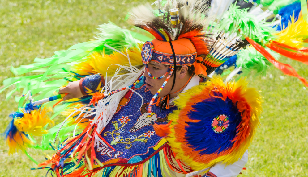 a white plate topped with a salad covered in shrimp